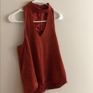 Burnt Orange, suede material top. Cute cut out.